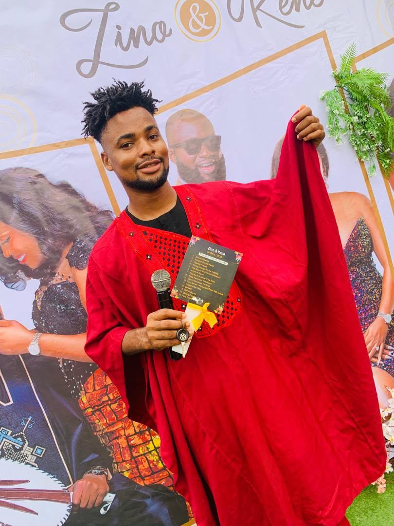 MC Walter hosting a wedding reception in traditional attire