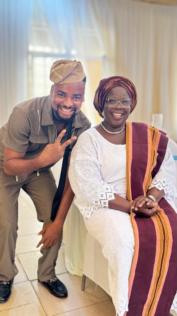 MC Walter with a family elder at a traditional event
